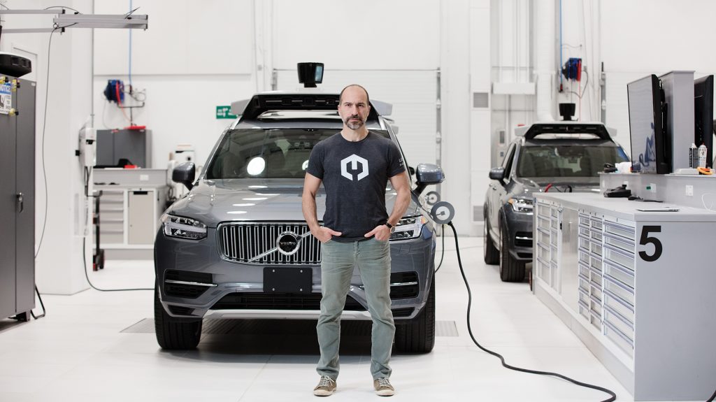 Photo of Dara Khosrowshahi in front of a self-driving car
